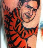 Charlie Sheen dressed in a tiger costume tattoo