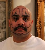 Clown face tattoo