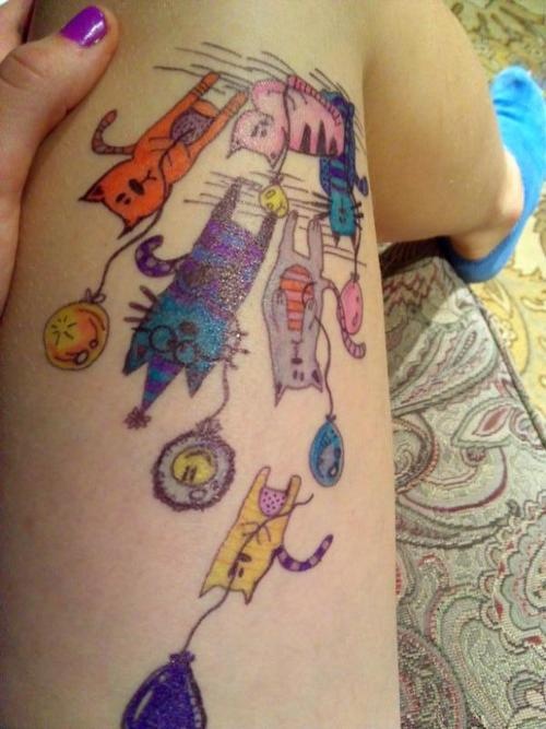 Colorful cats tattoo