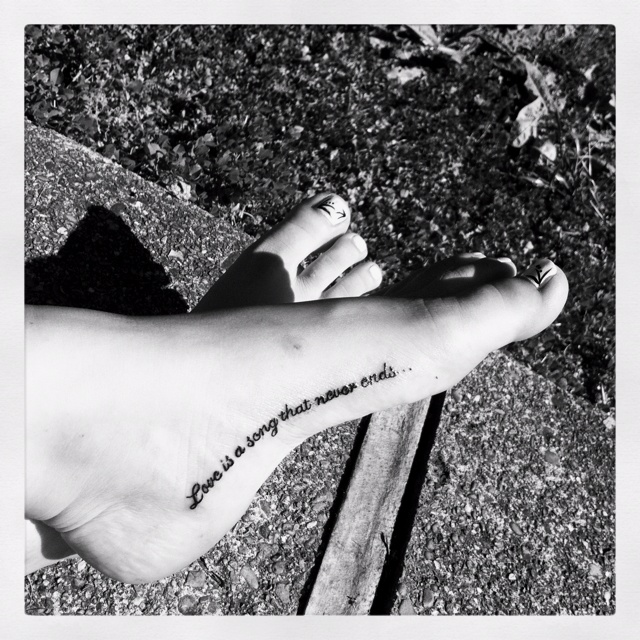 Cute quite tattoo on foot