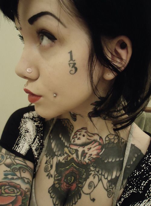 Devil number face tattoo