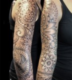 Dot shading arm tattoo