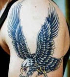 Eagle tattoo on man arm