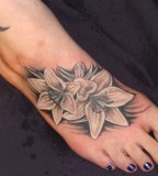 Flowers foot tattoo