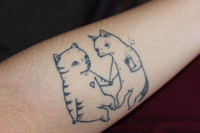 Friendly cats tattoo
