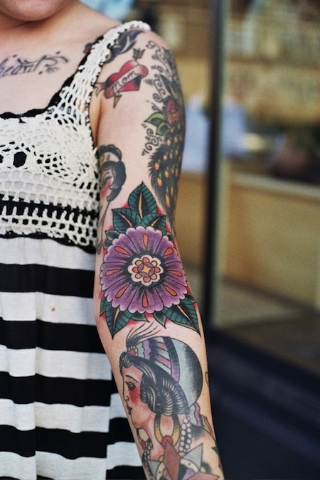 Girl and flowers tatoo on arm