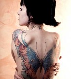 Great  butterfly tattoo on girl shoulder