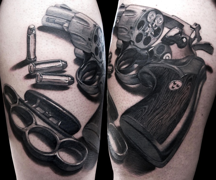 Gun tattoo by Matteo Pasqualin