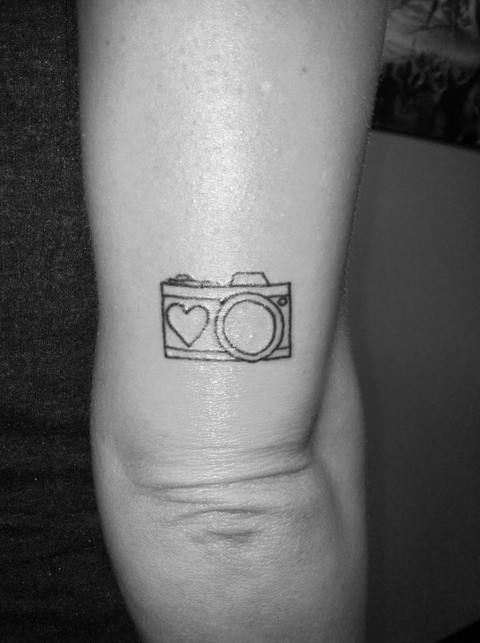 Heart and camera tattoo