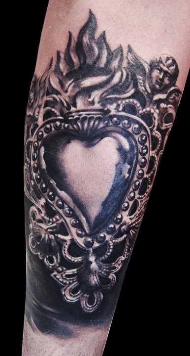 Heart tattoo by Matteo Pasqualin