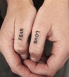 Love and fear fingers tattoo