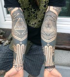 Patterned arm tattoo