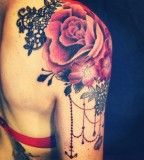 Red flowers shoulder tattoo