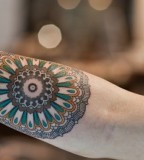 Round and colorful Mandala tattoo