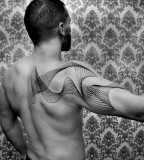 Shoulder tattoo by Chaim Machlev