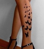 Simple butterfly tattoo on the leg