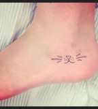 Small foot cat tattoo