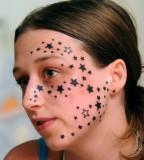 Star face tattoo