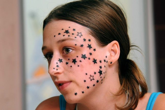 Star face tattoo
