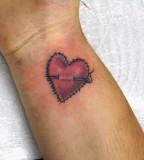 Stiched heart tattoo