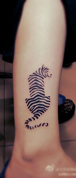 Stripes and lines tiger tattoo