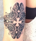 Symmetrical butterfly tattoo