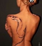 Woman pretty tattoo by Dimon Taturin