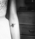 beautiful tattoo placement bee on inside arm