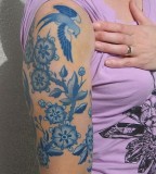 birds and flowers tattoo