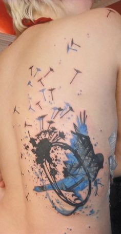 blue ink tattoo bird and dandelion
