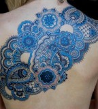 blue ink tattoo ornamental back piece