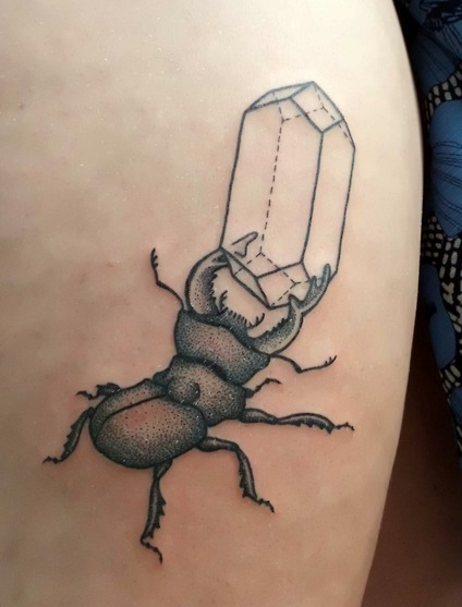 crystal tattoo with bug