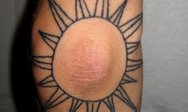 elbow tattoo sun