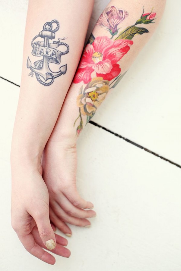 girly tattoo anchor and flowers on arms