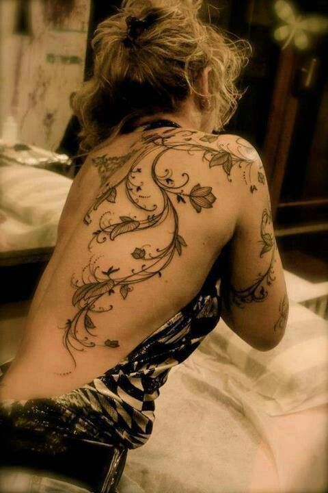 girly tattoo bindweed with flowers on back