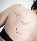girly tattoo birds on back