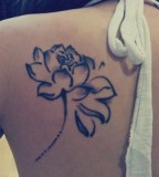 girly tattoo black flower on back
