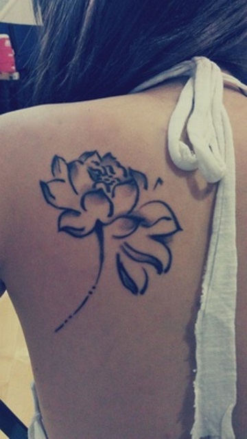 girly tattoo black flower on back