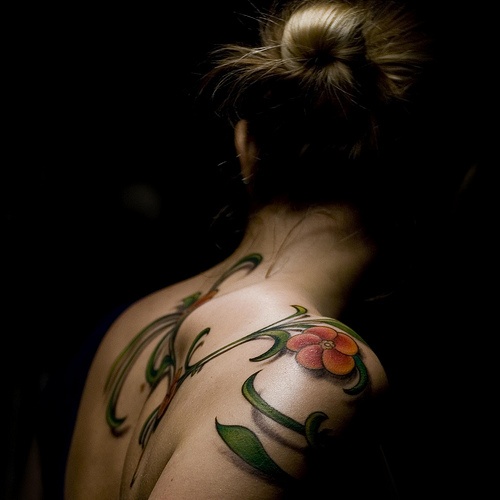 girly tattoo red flower and leaves on shoulder and back