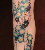 girly tattoo watercolor blue blossoms
