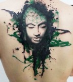 green tattoo watercolor buddha face on back