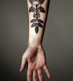 kamil czapiga abstract tattoo on arm