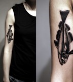 kamil czapiga fish tattoo on arm