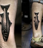 kamil czapiga fish tattoo on leg