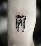 kamil czapiga tooth tattoo
