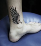 kamil czapiga wing tattoo on leg