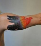 marcin aleksander surowiec tattoo bird on arm