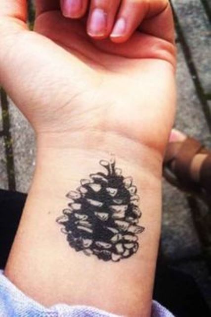 nature tattoo pine cone wrist tattoo