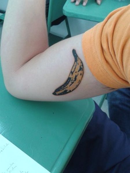 pop art tattoo banana on arm