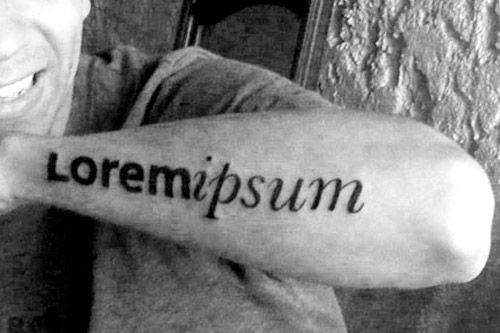 typographic arm tattoo lorem ipsum